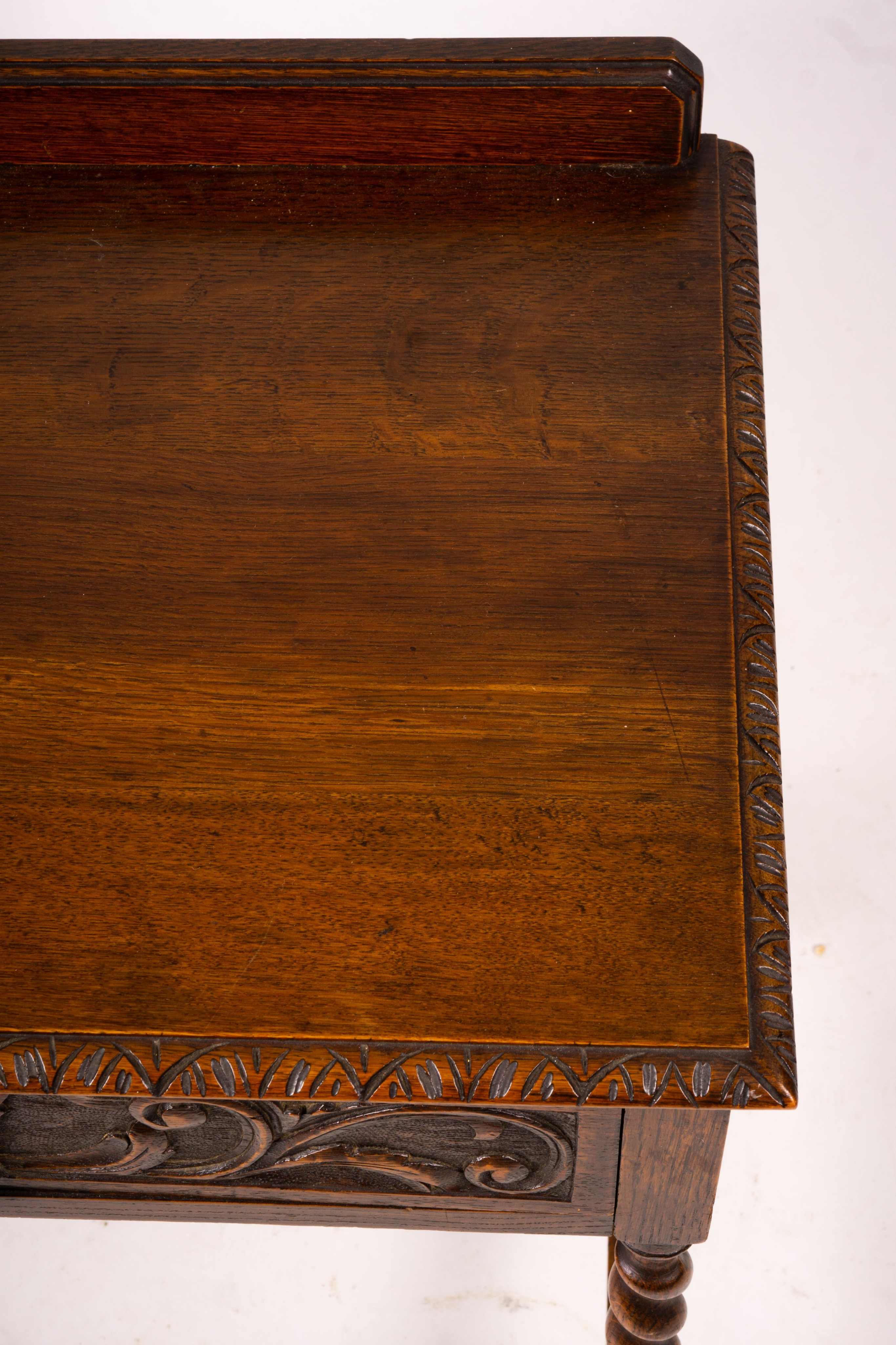 An early 20th century Flemish carved oak side table, W.69cm D.46cm H.77cm